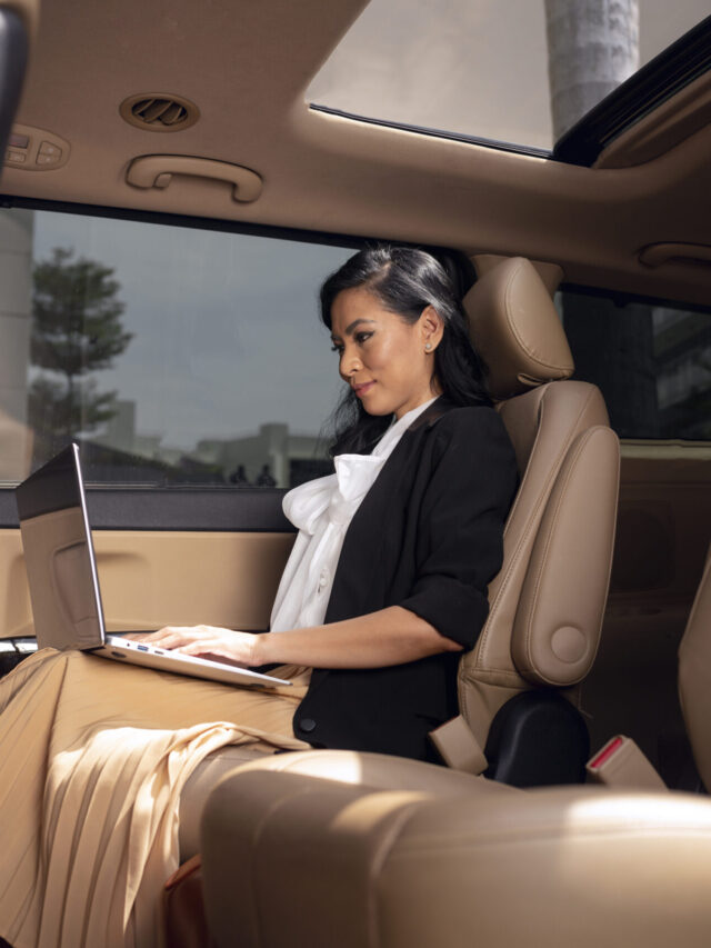 businesswoman-sitting-backseat-taxi